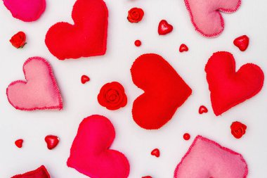 Assorted red and pink hearts isolated on white background. Valentine's day or Wedding romantic concept, top view, copy space, flat lay