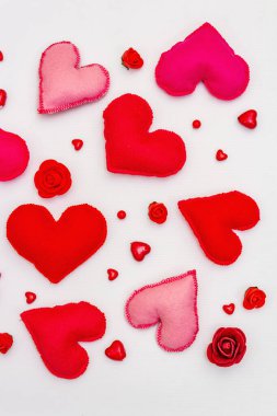 Assorted red and pink hearts isolated on white background. Valentine's day or Wedding romantic concept, top view, copy space, flat lay