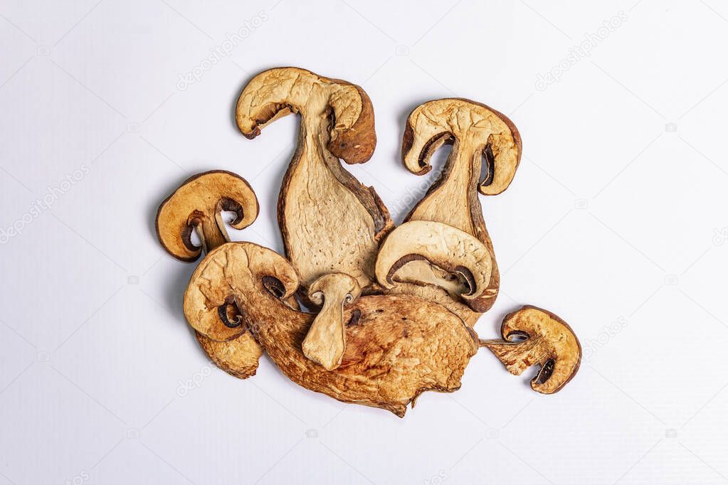 Dried mushrooms Boletus edulis (Penny bun, Cep, Porcini) isolated on white background. Ingredient for vegetarian (vegan) healthy food