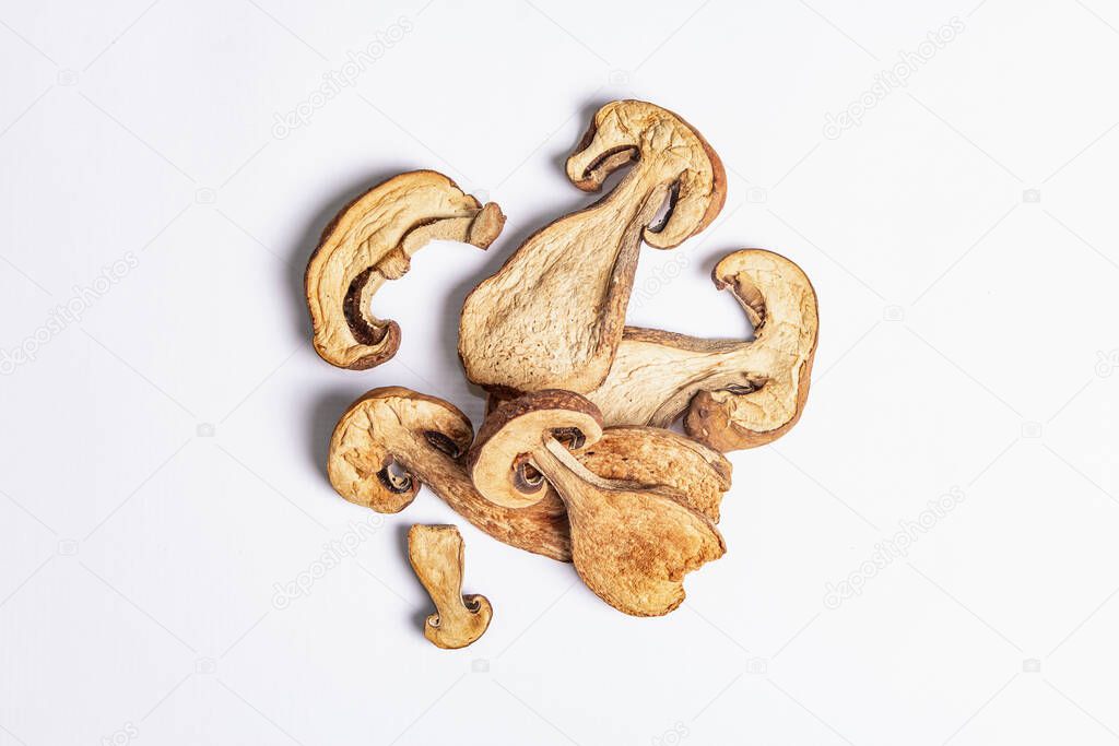 Dried mushrooms Boletus edulis (Penny bun, Cep, Porcini) isolated on white background. Ingredient for vegetarian (vegan) healthy food