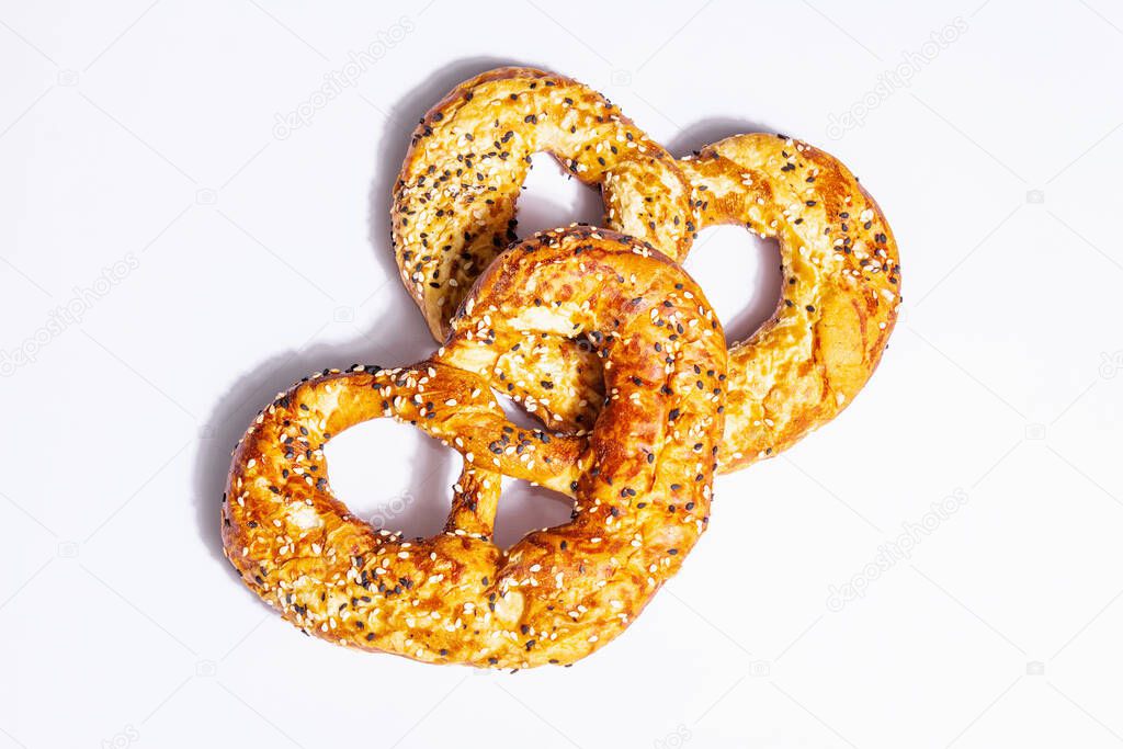 Oktoberfest concept - pretzels isolated on a white background. A trendy hard light, dark shadow
