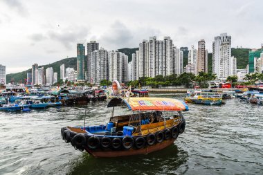 Traditional fishing trawler in Aberdeen Bay. A famous floating village in Aberdeen is an area and town on the south shore of Hong Kong. clipart