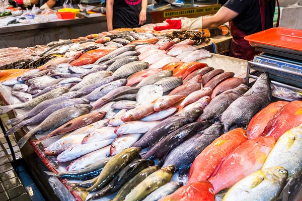 A stall selling fish at the traditional market in Kaohsiung, Taiwan. This is a large traditional market in North Kaohsiung, Taiwan