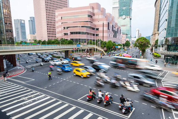 The crossroads near Taipei 101 Building and Taipei International Convention Center in Taipei, Taiwan, is in a busy rush hour of traffic.