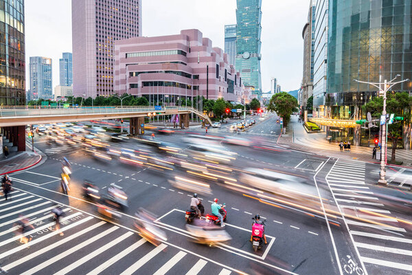 The crossroads near Taipei 101 Building and Taipei International Convention Center in Taipei, Taiwan, is in a busy rush hour of traffic.