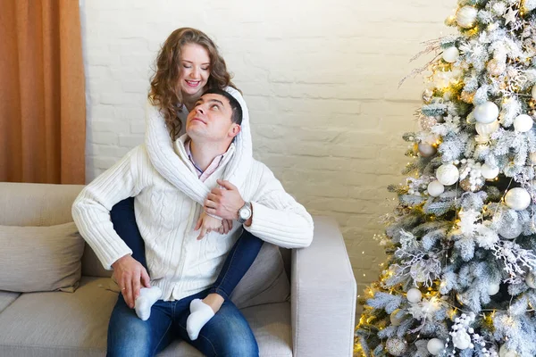 Loving Couple Hugging While Sitting Sofa Christmas Tree Winter Holiday — Stock Photo, Image