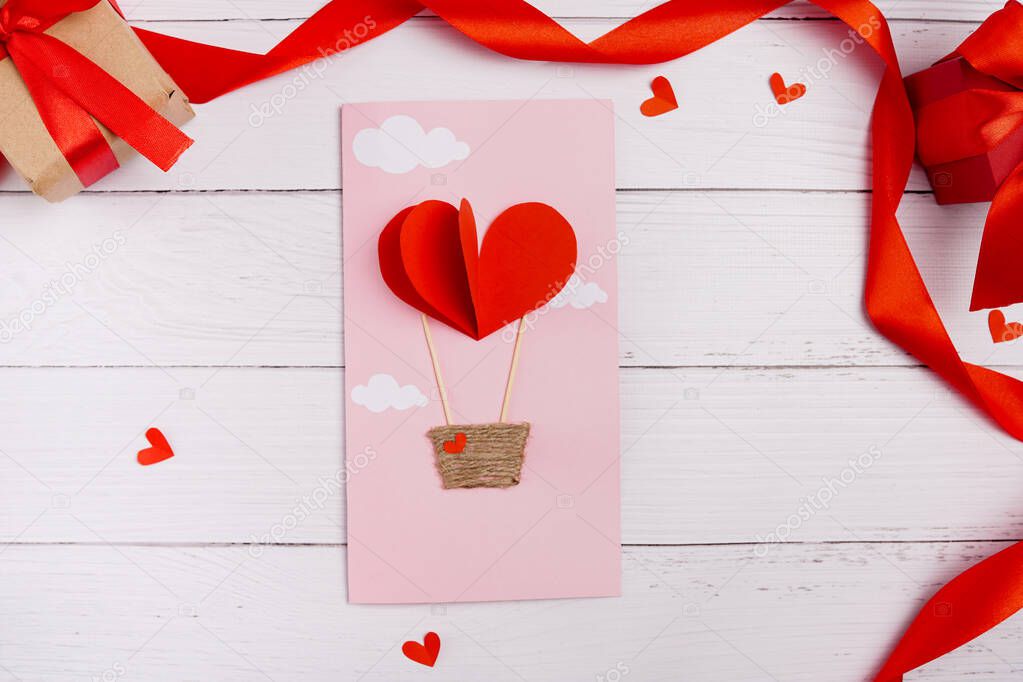 Valentines diy. Step by step instruction for handmade valentine greeting card with parachute from hearts. Craft gift, flat lay. step 3