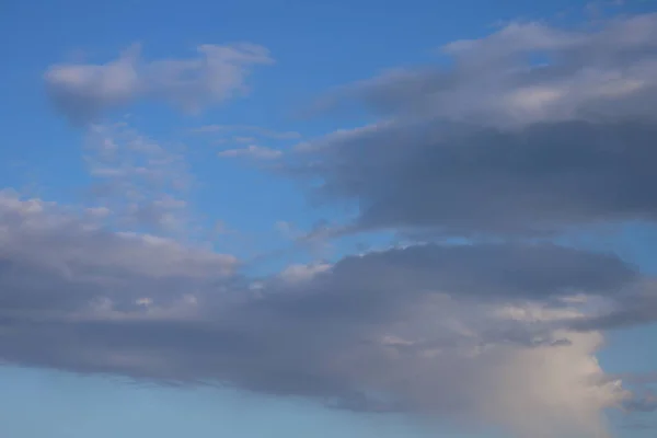 Blue spring sky and white clouds. Sky with clouds.