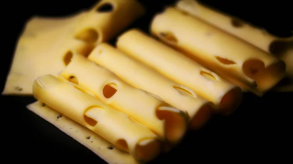 Soft Focus Rolls Cheese Black Background Cheese Holes Rolled Tube — Stock Photo, Image