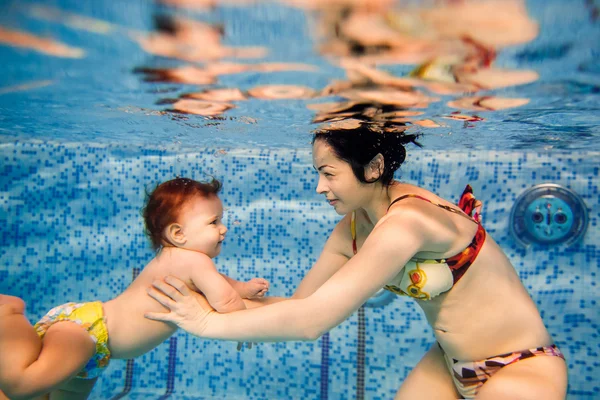 Child swims underwater