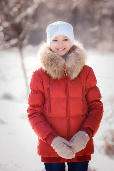 Beautiful girl in winter forest