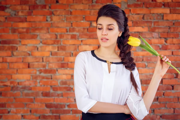 Beautiful girl with tulip.