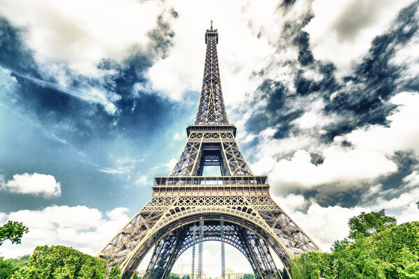 Tower Eiffel with cloudy sky on background, Paris, France
