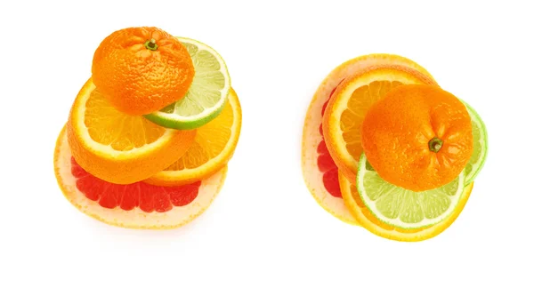 Stack av skivade citrusfrukter över vita isolerade bakgrund — Stockfoto