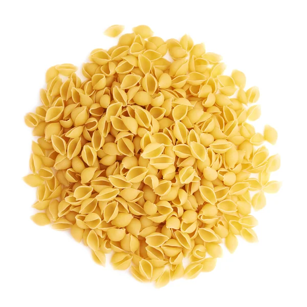 Pile of dry conchiglie pasta over isolated white background — Stock Photo, Image