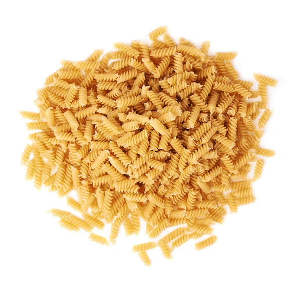 Pile of dry rotini pasta over isolated white background — Stock Photo, Image