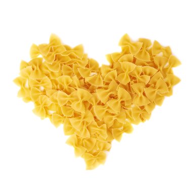 Heart shape made of dry farfalle pasta over isolated white background clipart