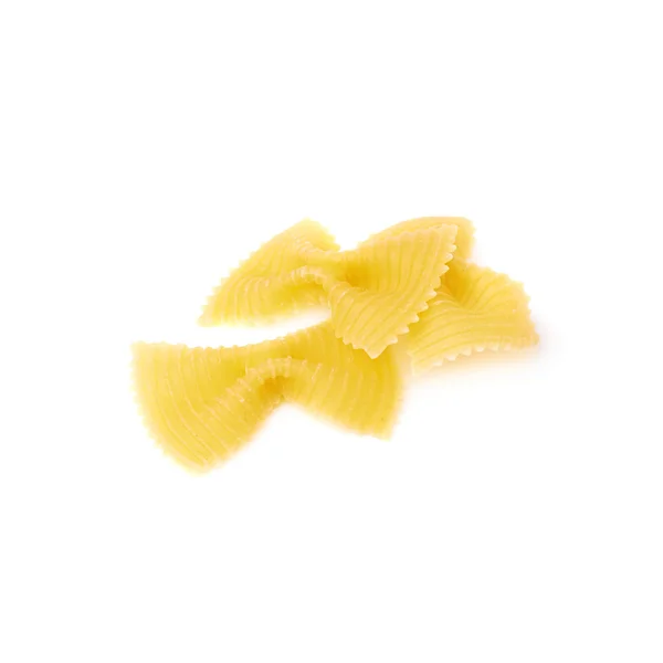 Haufen trockener Farfalle-Pasta über isoliertem weißem Hintergrund — Stockfoto