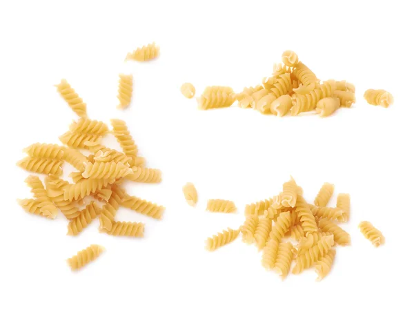Pile of dry pasta rotini over isolated white background — Stock Photo, Image