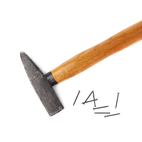 Big hammer with pile of nails over white isolated background — Stock Photo, Image