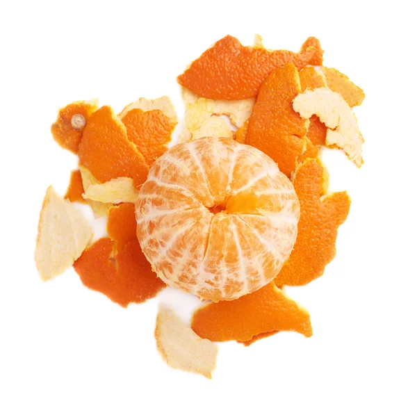 Tangerine on a pile of its peel isolated on white background — Stock Photo, Image