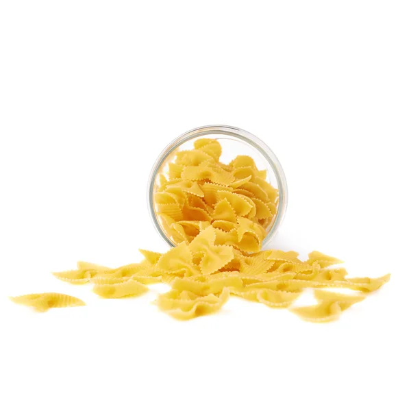 Glass jar filled with dry farfalle pasta over isolated white background — Stock Photo, Image