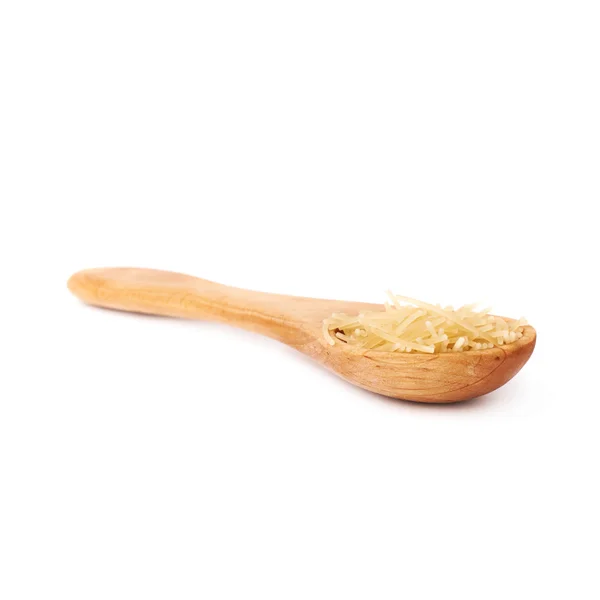 Wooden spoon filled with dry noodles pasta over isolated white background — Stock Photo, Image