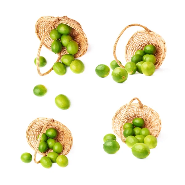 Wicker basket full of multiple ripe limes, composition isolated over the white background, set of four different foreshortenings — Stock Photo, Image
