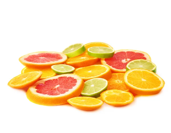 Surface covered with citrus sliced fruits over white isolated background — Stock Photo, Image