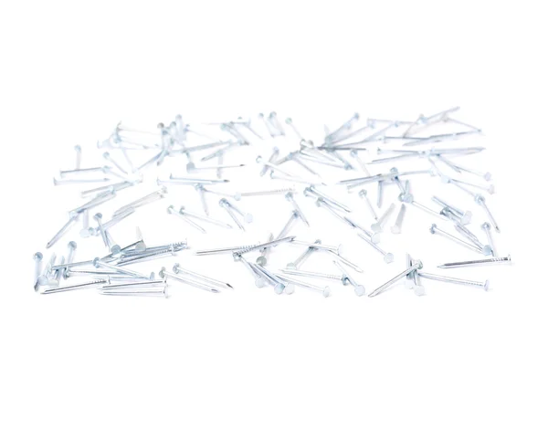 Scattered nails over surface isolated over white background — Stock Photo, Image