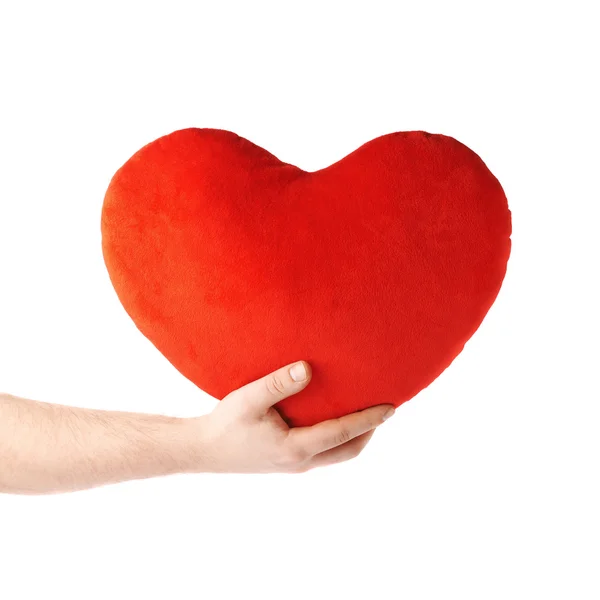 Hand holding a plush red heart, composition isolated over the white background — Stock Photo, Image