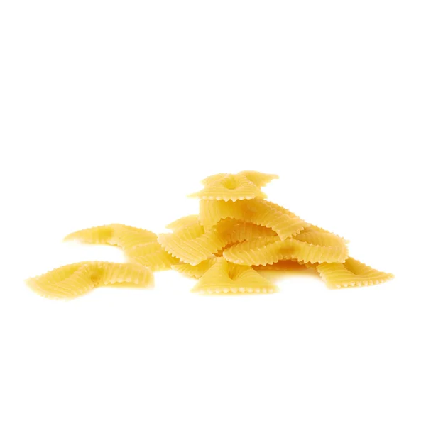 Pile of dry farfalle pasta over isolated white background — Stock Photo, Image