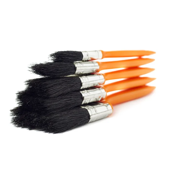 Pile of Paint brushes over isolated white background — Stock Photo, Image