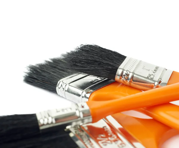 Pile of Paint brushes over isolated white background — Stock Photo, Image