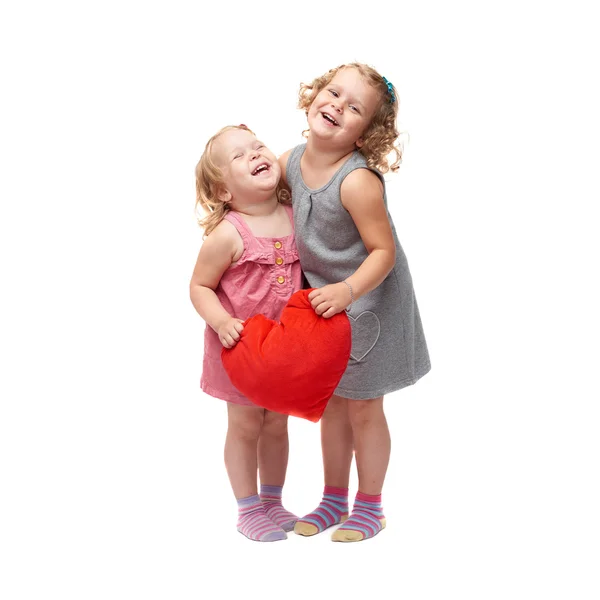 Dvě mladé holčičky stojící nad izolované bílé pozadí — Stock fotografie
