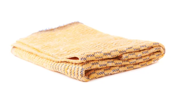 Skládané žlutý ručník izolovaných bílém pozadí — Stock fotografie