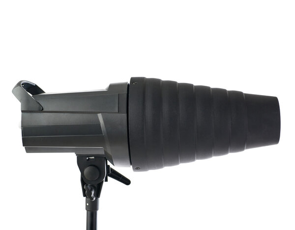 Pulse studio flash with a conical snoot on a stand over isolated white background