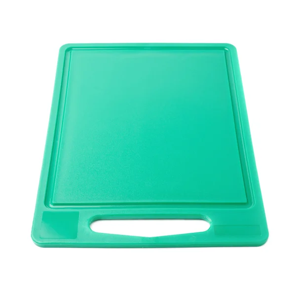 Unused plastic green cutting board isolated over the white background — Stock Photo, Image