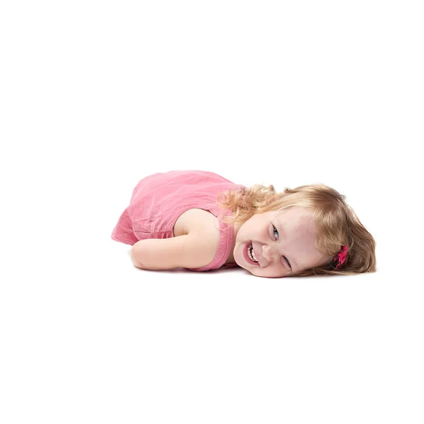 Little Blonde Happy Girl In Pink Swimsuit Lying On The Floor Stock