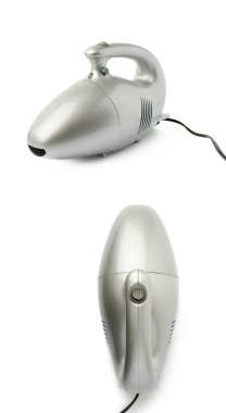 Tutulan küme el beyaz arka plan üzerinde izole küçük elektrikli süpürge