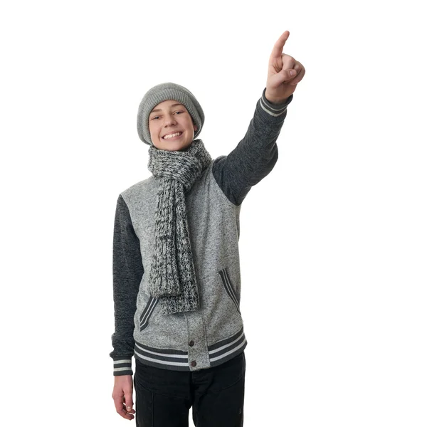 Niedlicher Teenager Junge in grauem Pullover über weißem isoliertem Hintergrund — Stockfoto