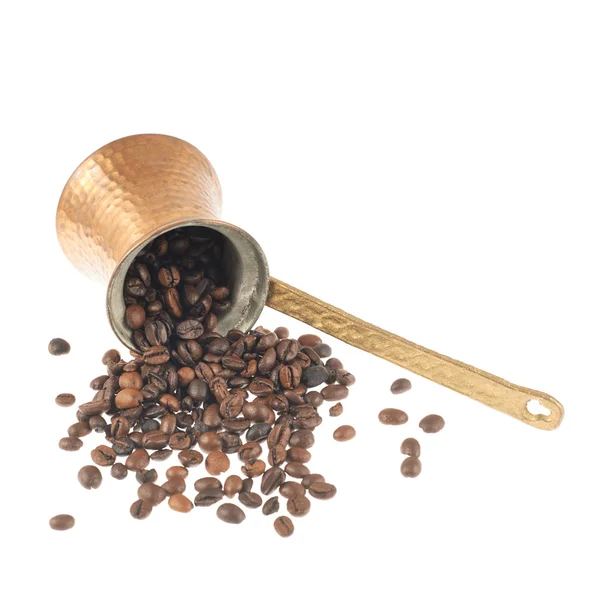 Copper cezve and coffee beans — Stock Photo, Image