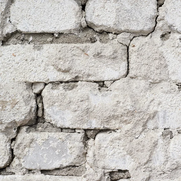 Gruñón pared de ladrillo blanco — Foto de Stock