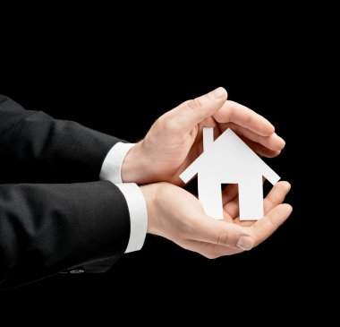 el kağıt ev tutarak