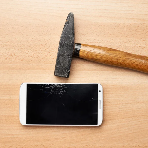 Hammer and broken phone — Stock Photo, Image