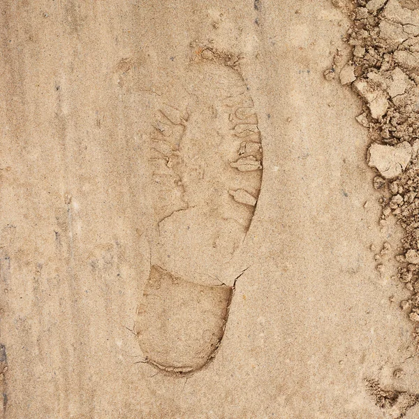 Schuhschritt im Sand — Stockfoto