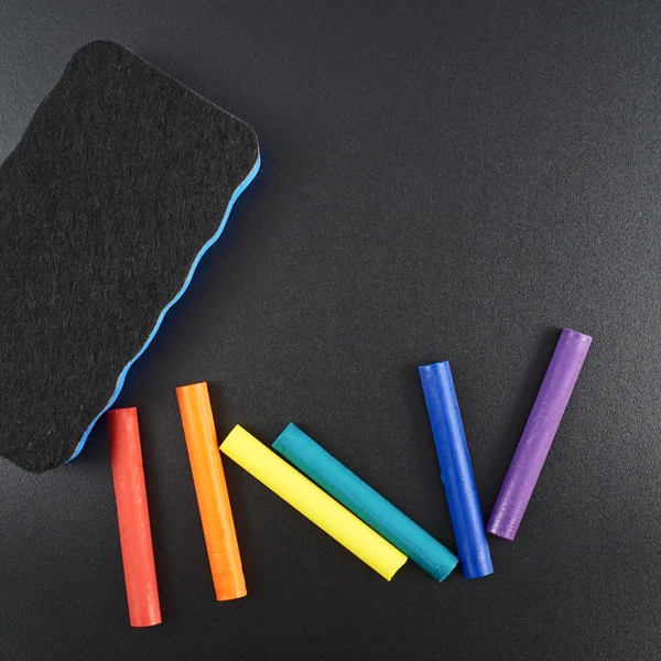 Black board with chalks — Stock Photo, Image