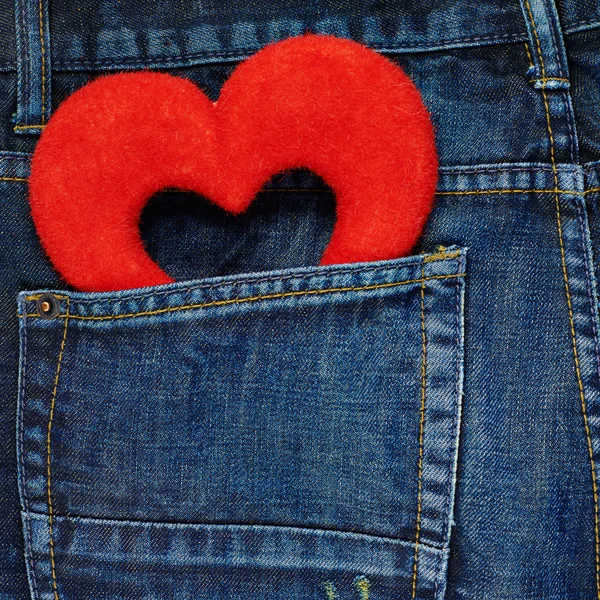 Red heart in a back pocket of a jeans — Stock Photo, Image