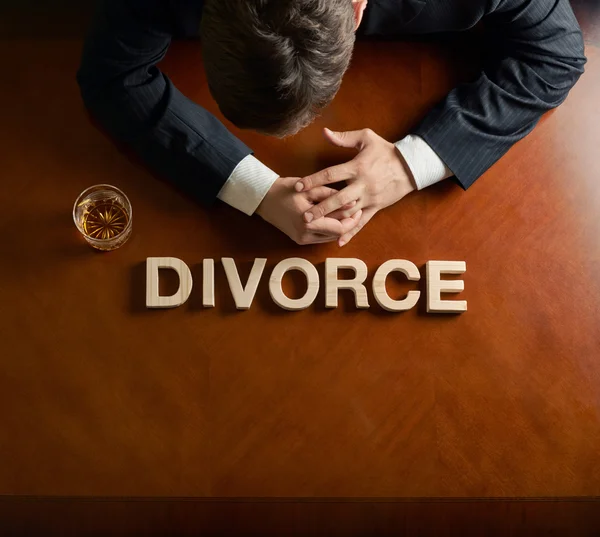 Word Divorce and devastated man composition