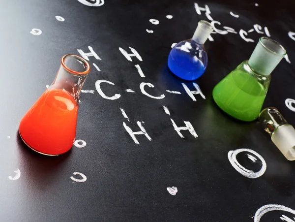 Chemistry tubes filled with colorful liquids — Stock Photo, Image